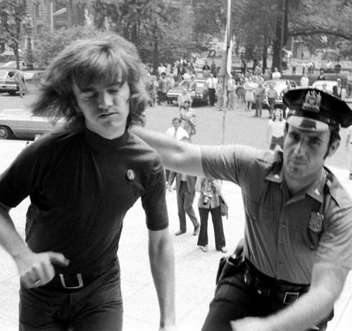 Jim Owles, President of Gay Activists Alliance (GAA), submits to arrest on the steps of City Hall, N