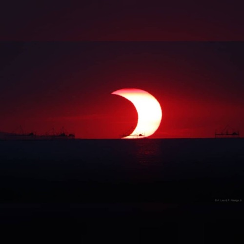 XXX A Partial Eclipse Over Manila Bay #nasa #apod photo