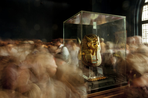 unrar:  Tourists visit King Tut’s funerary mask in Cairo’s Egyptian Museum, Kenneth Garrett. 