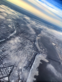 travelingcolors:  Flying over snow-covered