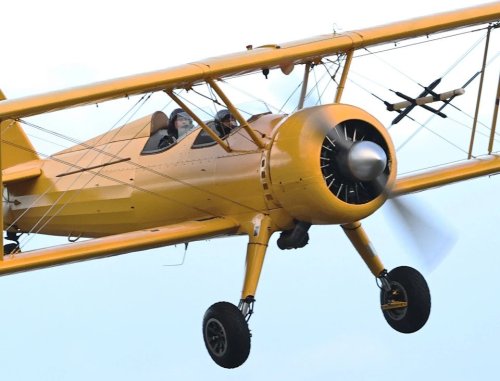 imfupdates:Tom Cruise, Jill Taylor and crew practices a stunt involving a bright yellow biplane for 