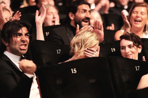 Diane Kruger reacts next to Fatih Akin after she was awarded with the Best Actress Prize for her par
