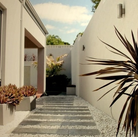 Perth LandscapeAn Example Of A Mid-sized Contemporary Drought-tolerant And Partial Sun Backyard Water