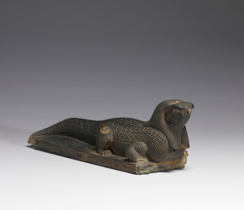 Ancient Egyptian steatite sculpture of a crocodile with a falcon’s head, representing either the dei