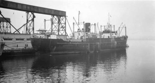 Top photo: A seaman of the Danish merchantman MS Tureby in a British port. Tureby and her crew saile