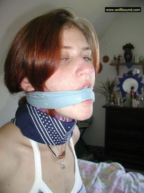 graybandanna:  While she was still bandanna bound and gagged, at least the captor was nice enough to remove the scarf stuffing and the bandanna tied over her mouth