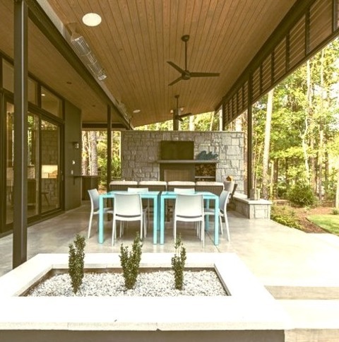 Patio Roof ExtensionsIdeas For A Sizable, Modern Backyard Renovation That Includes A Fireplace And A