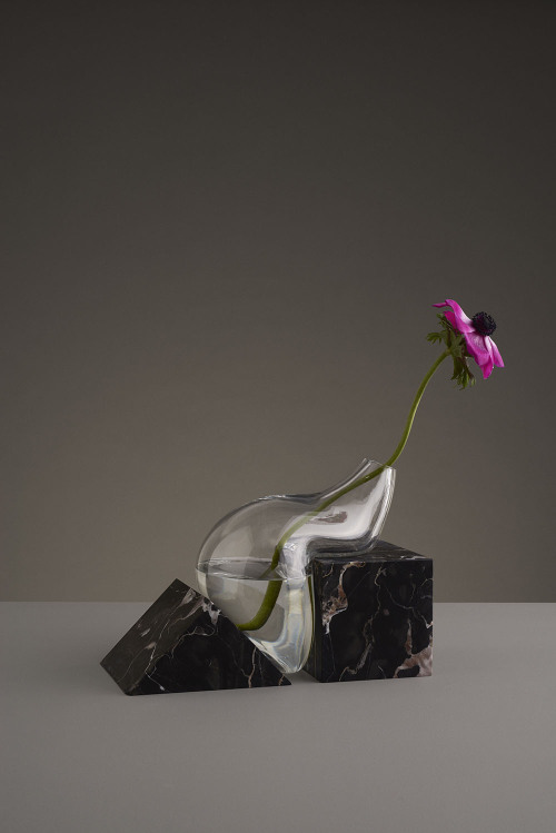 talkingtrashcan:taktophoto:Misshapen Glass Vases by Studio E.O Appear to Melt Atop Angular Stone Pla