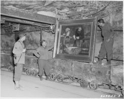 historicaltimes:  American soldiers discover Manet’s “In the Conservatory” that was hidden  in the salt mines of Merker, Germany. 1945. via reddit 