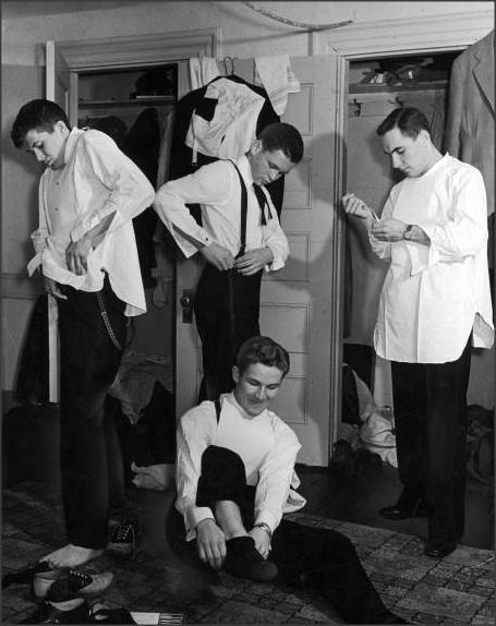 Four freshman in Maine Hall dormitory at Bowdoin College dressing for formal dance, 1939