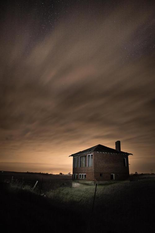 abandonedandurbex:Abandoned Farmhouse and City Glow in Rural South Dakota. Rob G. Green[3755x5632]