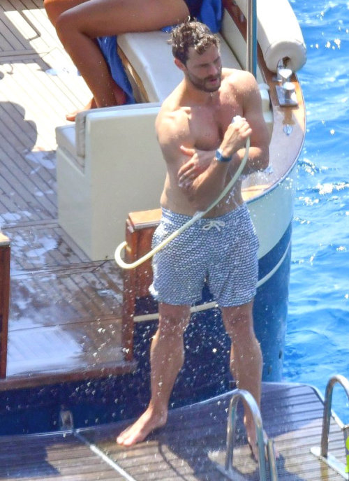 niftyshadesofmelissa:  Jamie Dornan Shows Off His Chiseled Wet Body on boat trip in Capri, Italy 