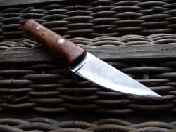 ru-titley-knives:  My Wife’s Bushcraft knife. Blade is flat ground 01 tool steel made by Alistair Napier a British knife maker who also makes some great knife grinders. Handled by me many years ago in Thuya burl wood over copper liners with copper and
