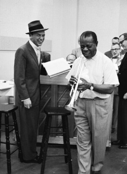 foreverfranksinatra:  Frank Sinatra and Louis Armstrong photographed during a recording session. 
