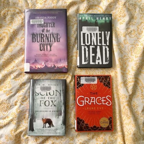 Library books . These four books are due back in a few days. I’d be re-reading Daughter of th