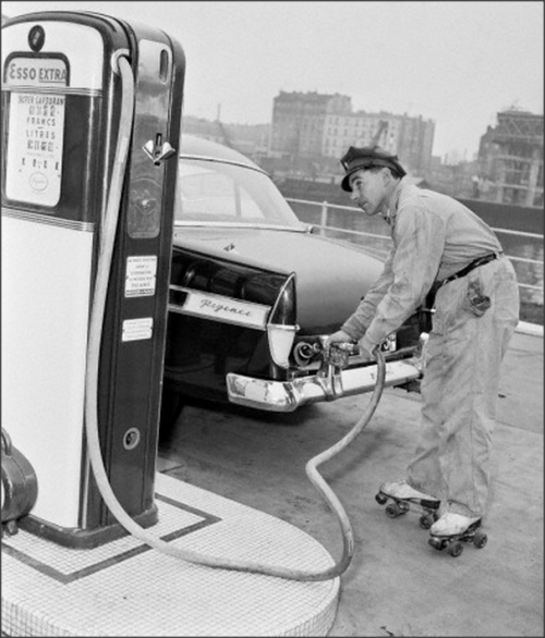 Gas Station attendant on rollerskates 1957