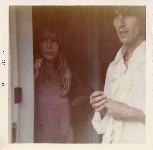 George Harrison and Pattie Boyd standing at the door of Kinfauns in Esher, England. (1968) Photos by