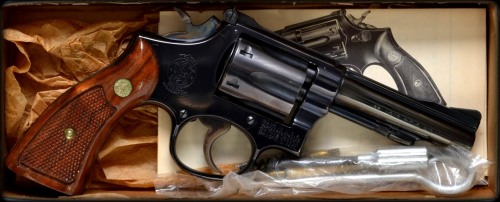 carlosavo:  Top to bottom: Smith & Wesson 10-5 .38spl Smith & Wesson 18-3 .22 Smith & Wesson 686-1 .357mag Photographed for Savo Auctioneers, LLC. Photo by Carlo Savo