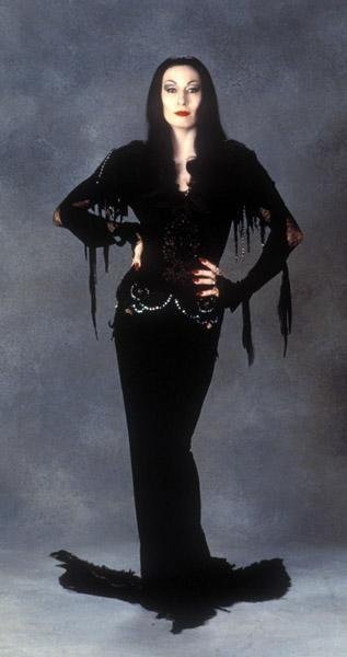 the-glamour-ghoul:  Oh Tish… Hero, icon, glamour ghoul. Carolyn Jones, Anjelica