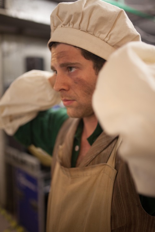 Max Quinlan affixing his hat in a quick change. Photo by maxgordonphotography.