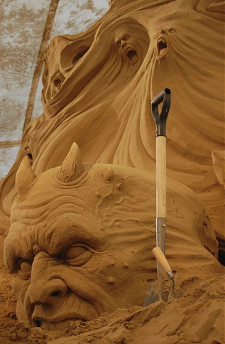 sixpenceee:These Dante’s Inferno sand sculptures are from the International Sand Sculpture Festival.