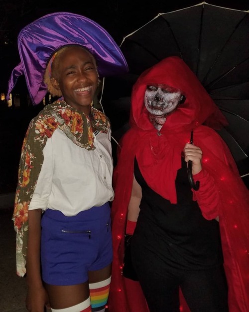 pldubrahs:[ID: two pictures of me, a nonbinary black person with a short blond afro, in taako cospla