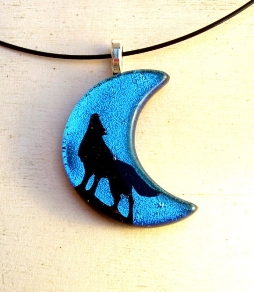 A collection of fused glass wolf necklace pendants and earrings that I hand created in my studio!Lik
