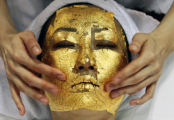 coltre:  A gold facial is a treatment that lifts and firms the skin to reduce the appearance of fine lines, wrinkles and brighten the skin, using a cream made with 24 carat gold foil.  what the fuck???