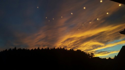 groovyherbs:  thesevibesseemfine:  penizpizza:  The lights in my room reflected from my window and looked amazing in the sky   Aliens  This is enchanting