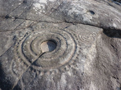 Prehistoric large cup and ring petroglyph at &lsquo;Laxe das Rodas&rsquo;, Galicia, Spain.Cup and ri