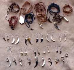 thegreenwolf:  Just finished making up a big batch of my popular tooth, claw and bone jewelry! There are teeth and claws from critters ranging from red fox to American badger to bobcat, bones from snakes and mice, deer antlers, and more, all made into