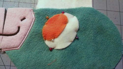 janelles-plushies:  A little lesson in appliqueing an eye onto a head: 1. Lay the head piece you will be appliqueing on a flat surface2. Lay your pattern on top of your head piece to identify where the eye will be placed and slide your tear away backing