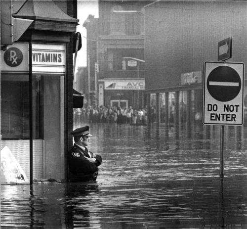 Imagesofthepast:  Canadian Police Officer Guarding The Pharmacy In Waist-High Flood