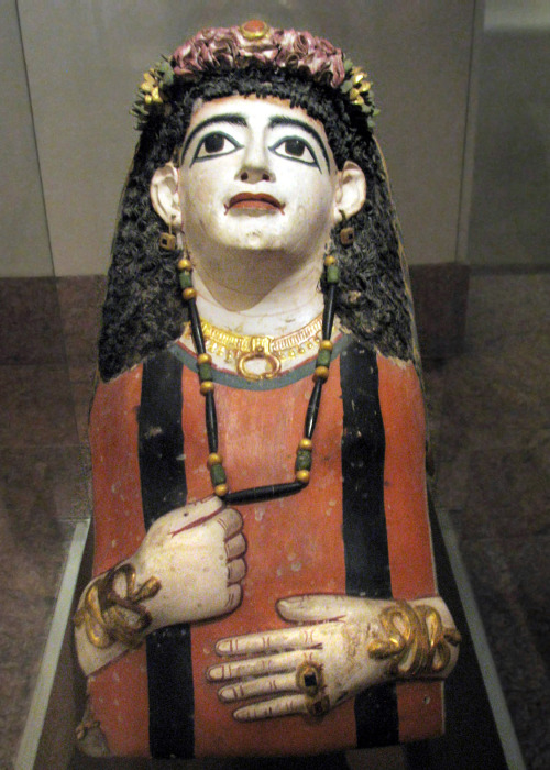 Mummy mask of woman wearing a jeweled garland. Made of plaster, cartonnage and paint, 1st c. A.D.