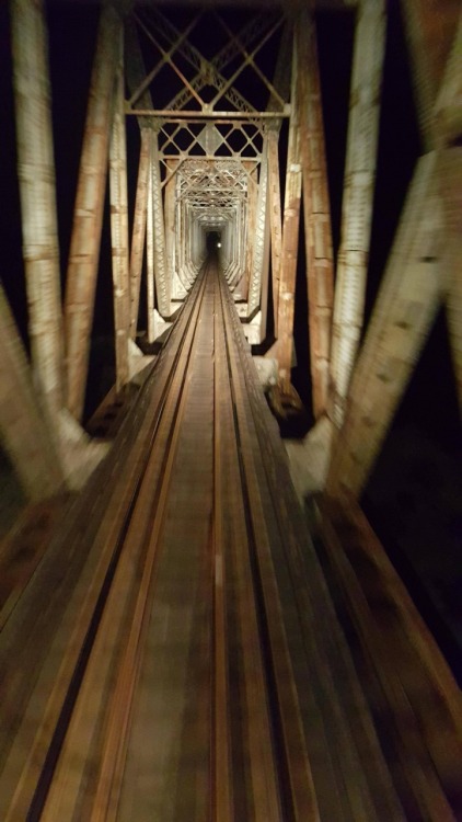 southernsideofme:Going over west Texas Railroad Bridge at night.