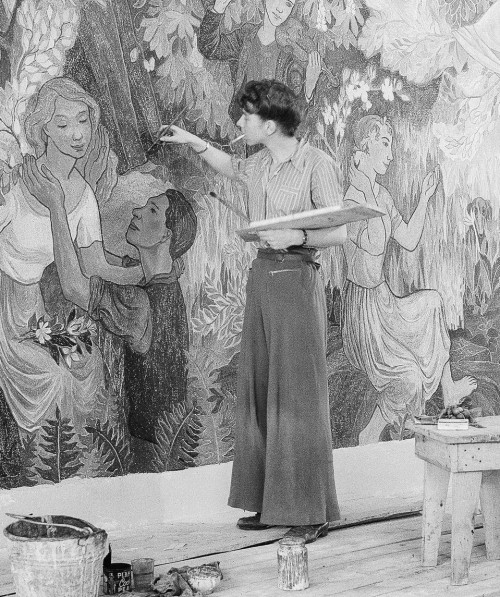 stormysapphic:Tove Jansson painting the fresco Party in the Countryside, Helsinki, 1947