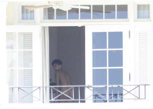 Rihanna caught naked while changing bikinis.