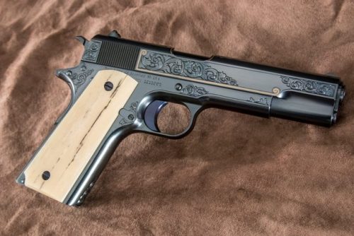 gunrunnerhell:  Turnbull 1911 A special edition 1911 made by Turnbull Manufacturing. Custom engraving with minimal gold inlay with giraffe bone grips. Serial number 1911001 makes this the first 1911 from Turnbull Mfg. Although very simple looking compared