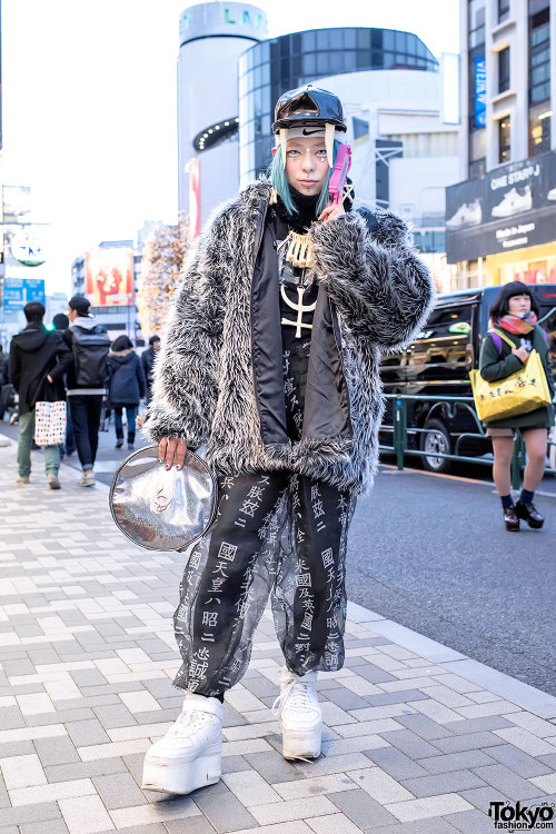 Shoshipoyo on the street in Harajuku wearing a vintage/resale jacket over a Buccal Cone sheer kanji 