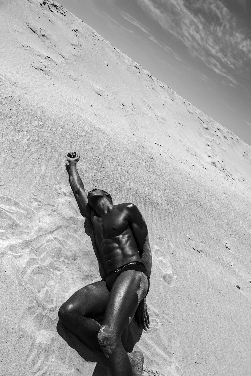 chriscruzism:  Model Chris Lylez represented by Silver Models and photographer Gregory Prescott come together for a super come back. Exuding a raw sensuality, a lean Chris hits the sand, modeling classic CK brief underwear in a black and white