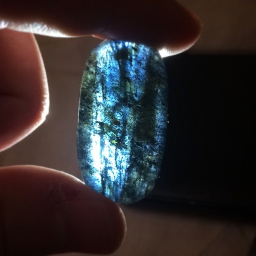 Midnight blue kyanite in a silver wire frame.