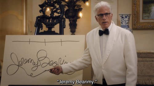“Jeremy Bearimy.” Michael points to a loose cursive drawing of Jeremy Bearimy made with one continuous line.