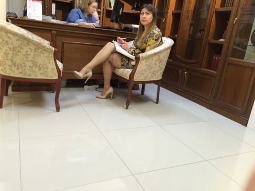 Lady in office. Ilove her crossed legs and high arched feet!