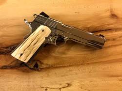 rollerman1:Wooly mammoth tusk ivory grips on this Cabot Deluxe 1911. 