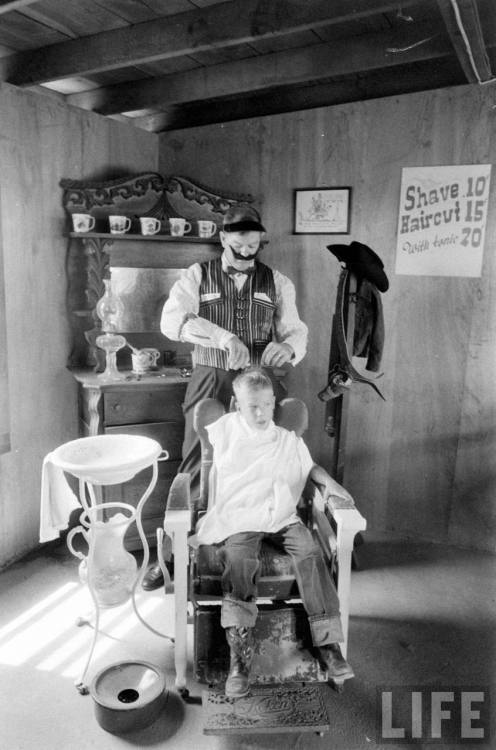 Getting a trim in Cowboy Town(Thomas McAvoy. 1960)