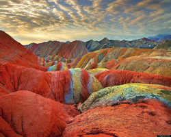 death-by-dior:  leslieseuffert:  At first glance, you’d assume that these images couldn’t possibly be real. Surprisingly, they are actual mountains in China’s Danxia Landform Geological Park. The incredible colours are the result of layers of sandstone