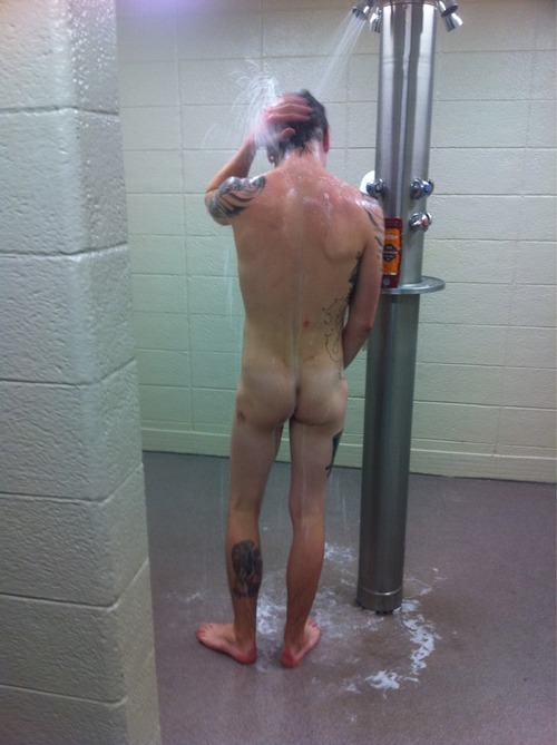 menslockerroomreal: Tattooed man showers in locker room