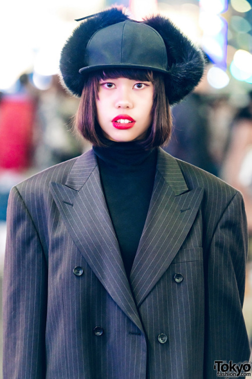 Japanese teens Rio and Sarah on the street in Harajuku at night wearing a mix of vintage and new fas