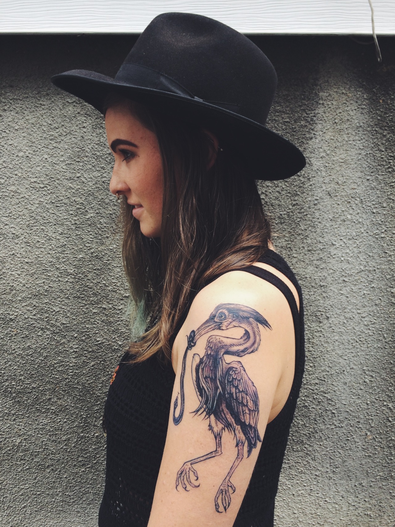 Heron tattoo on the left shoulder blade