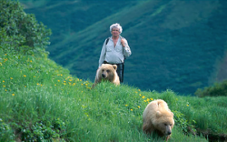 nubbsgalore:  charlie russell spent eleven years in russia’s far east living with and raising grizzly cubs who were orphaned by poachers. the cubs, which were subsequently taken in by a zoo in petropavlovsk, were about to be shot by their keepers now